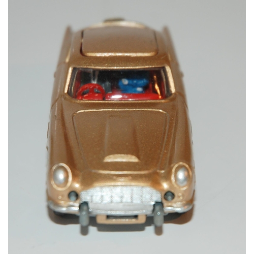 401 - A Corgi 261 James Bond Aston Martin D.B.5 from “Goldfinger” gold body, complete with sea... 