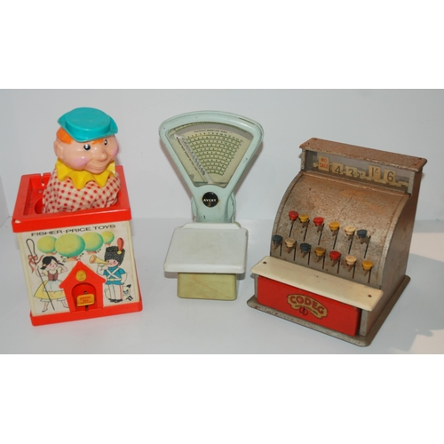 414 - A Fisher Price jack-in-the-box, child's scales and till