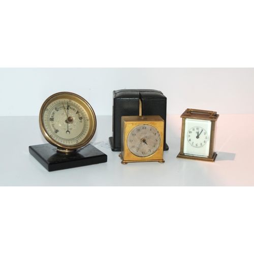 431 - A miniature travel alarm clock in fitted case, 5cm wide (af), a miniature carriage clock and a desk ... 