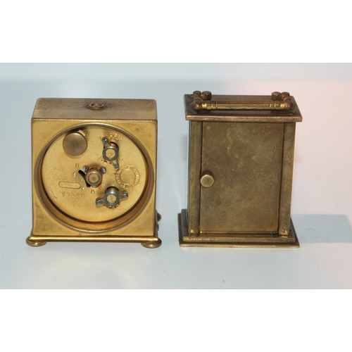 431 - A miniature travel alarm clock in fitted case, 5cm wide (af), a miniature carriage clock and a desk ... 