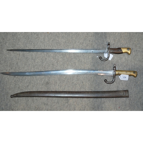 437 - A French bayonet, the blade inscribed, the guard and metal scabbard numbered AC 47793 and another, t... 