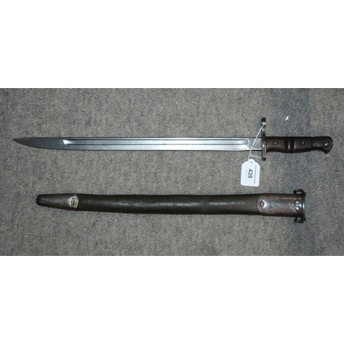 439 - An American bayonet by Remington, the blade stamped, in metal scabbard