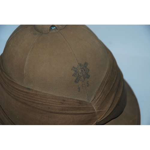 444 - A pith helmet the interior inscribed in ink Lt Jardine, Royal Scots, dated 1915, gaff, tribal axe an... 