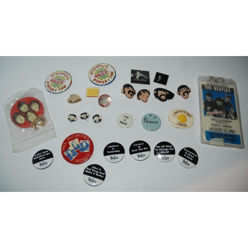 462 - A collection of Beatles lapel badges etc