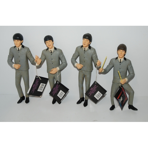 469 - A set of four Hamilton Gifts Ltd Beatles figures, 1991 with instruments, mics etc (lacking Paul's gu... 