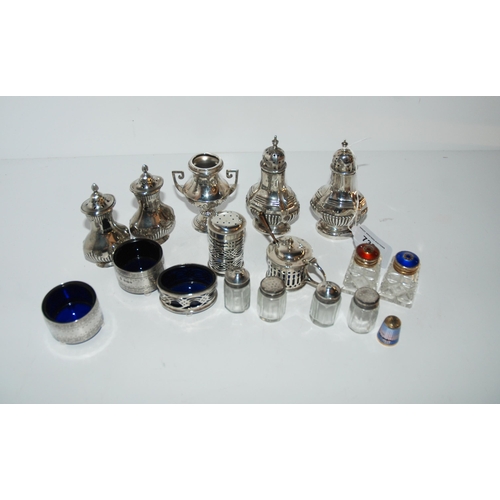 732 - Sixteen assorted silver salts, peppers and mustards, assorted makers and hallmarks and an enamelled ... 