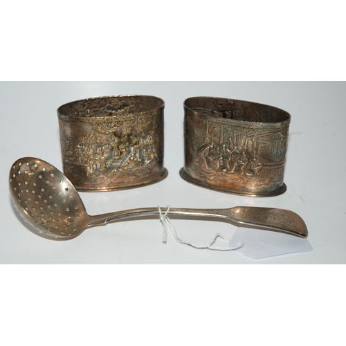 735 - A silver sifter ladle, Dublin marks, 18cm long and a pair of Danish embossed white-metal tooth pick ... 