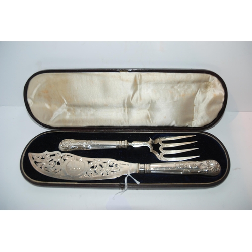 752 - A cased pair of silver fish servers with engraved and pierced decoration, Sheffield 1852