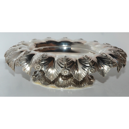 753 - A silver fruit bowl, London 1872 of circular form with frilled edge, foliate and flowerhead decorati... 