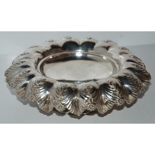 753 - A silver fruit bowl, London 1872 of circular form with frilled edge, foliate and flowerhead decorati... 