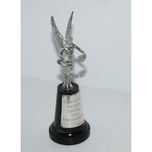 761 - A silver car mascot, a winged female, London 1969 on socle base with silver plaque inscribed 