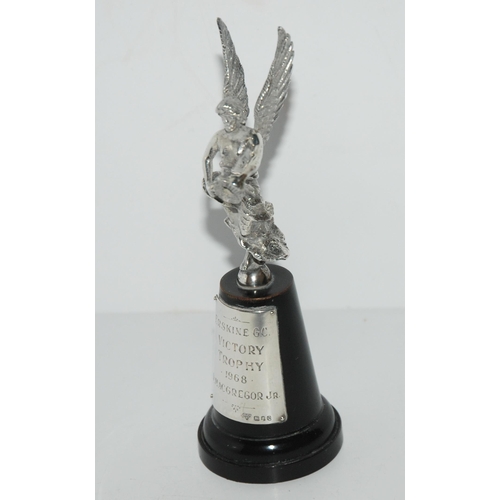 761 - A silver car mascot, a winged female, London 1969 on socle base with silver plaque inscribed 