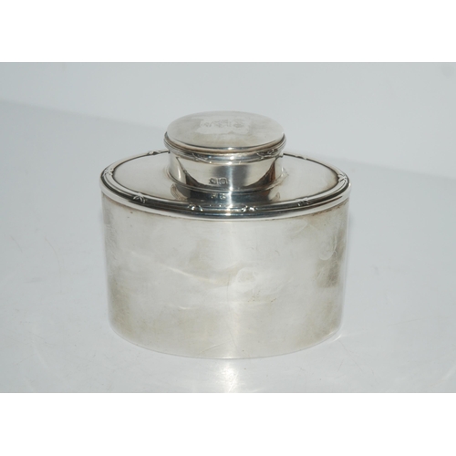 762 - A silver tea caddy, Birmingham 1919 of oval form, 9.5cm high, 131 grams