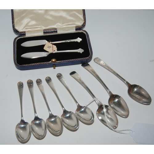 763 - A cased pair of butter knives, Sheffield 1934 with eight assorted silver coffee spoons