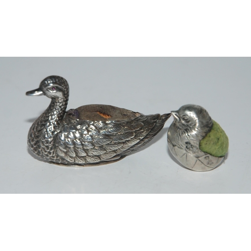 772 - Two novelty silver pin cushions modelled as birds, a duck, Birmingham 1908, 5.5cm long and a sparrow... 