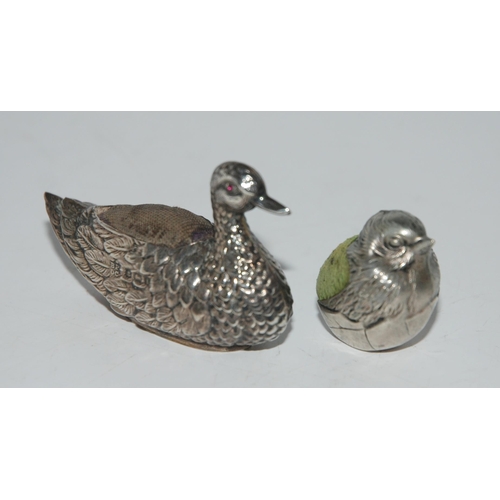 772 - Two novelty silver pin cushions modelled as birds, a duck, Birmingham 1908, 5.5cm long and a sparrow... 