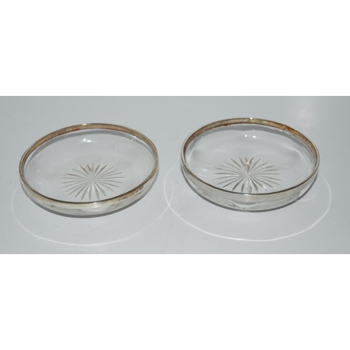 774 - A pair of silver-mounted glass dishes, Birmingham 1924, 10cm diameter