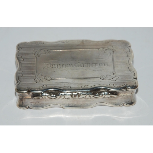 782 - A Victorian silver snuff box, Birmingham 1856, rectangular with engine turned decoration and cartouc... 