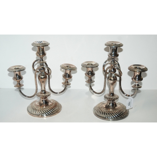 789 - A pair of silver-plated three-light candelabra, 27.5cm high