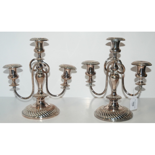 789 - A pair of silver-plated three-light candelabra, 27.5cm high