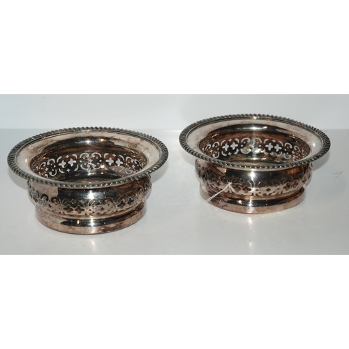 798 - A pair of silver-plated wine coasters, 17/5cm diameter