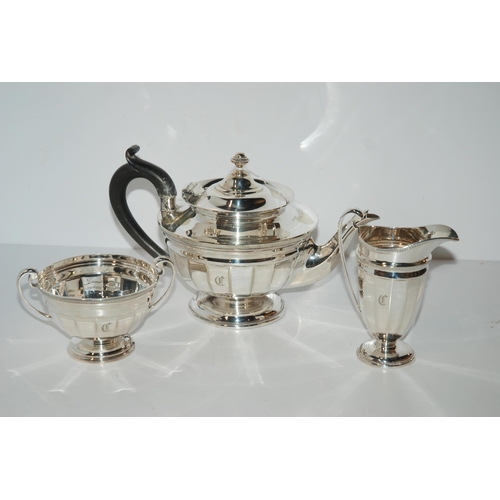 799 - A four-piece EP tea service including a kettle on stand