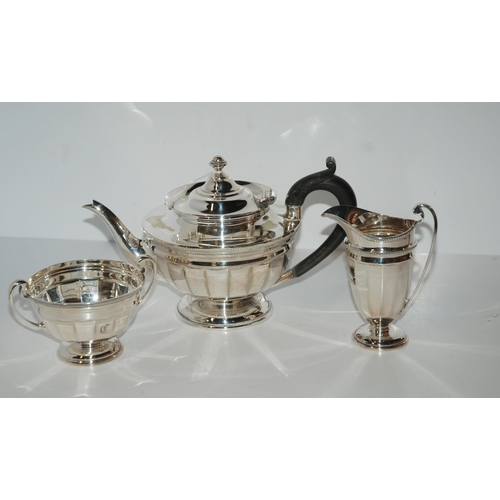 799 - A four-piece EP tea service including a kettle on stand