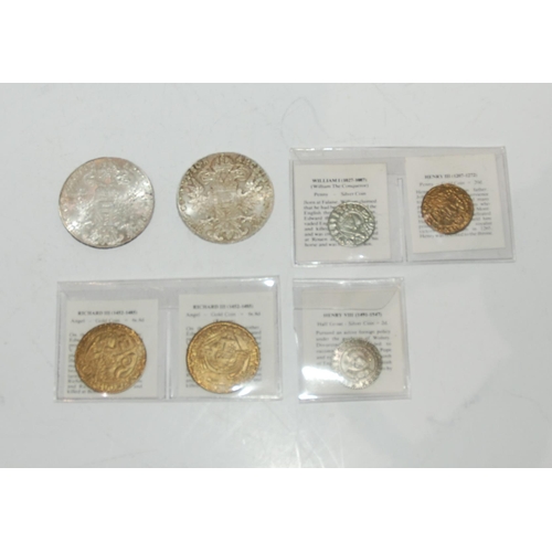 811 - A lot comprising two Maria Theresa thalers and five reproduction antique coins