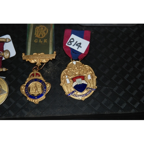 814 - A lot comprising one silver gilt Masonic medal, four gilt metal medals with a selection of small ena... 