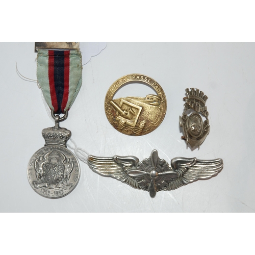 815 - A lot comprising a sterling silver Pilot's badge marked N S Meyer Inc. New York, a Duke of Connaught... 