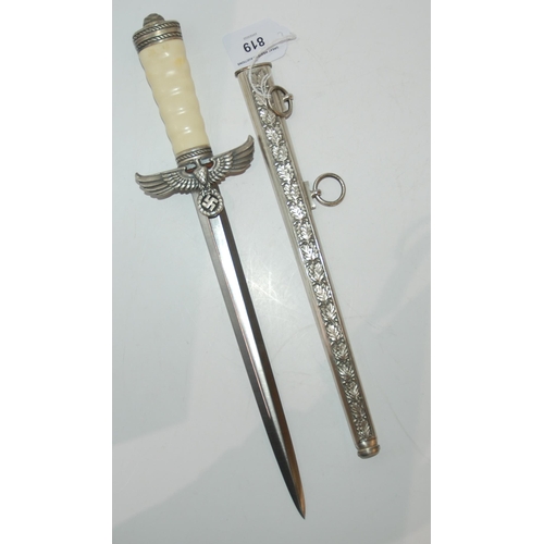 819 - A replica WW2 style German political leader's dagger in scabbard 41 cm o/all length