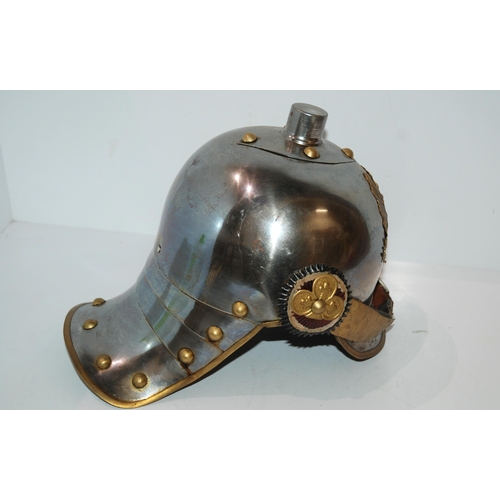 820 - A replica German lobster tail steel helmet