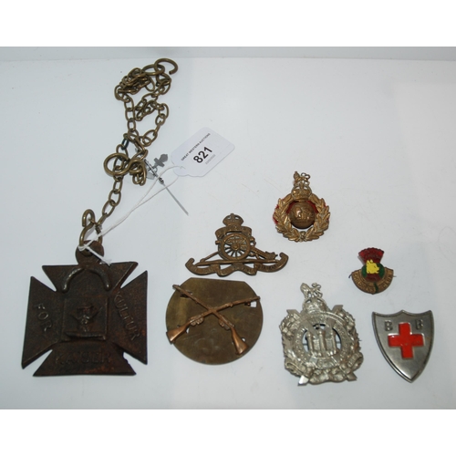 821 - A quantity of military badges with a British WW1 Propaganda Iron cross