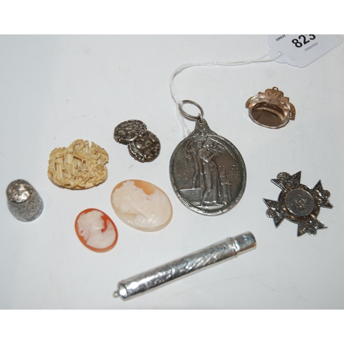 823 - A lot comprising a white metal Peace medal, a citrine set fob, two unframed cameos, a silver medal a... 