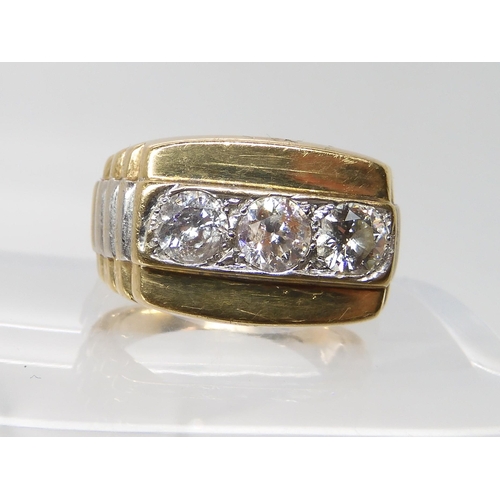 629 - A 9ct gold gents three stone diamond ring set with estimated approx 1.50cts of brilliant cut diamond... 