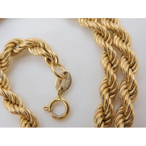 631 - A 9ct gold rope chain, length 45.5cm, together with two 9ct and silver gem set vintage rings, weight... 