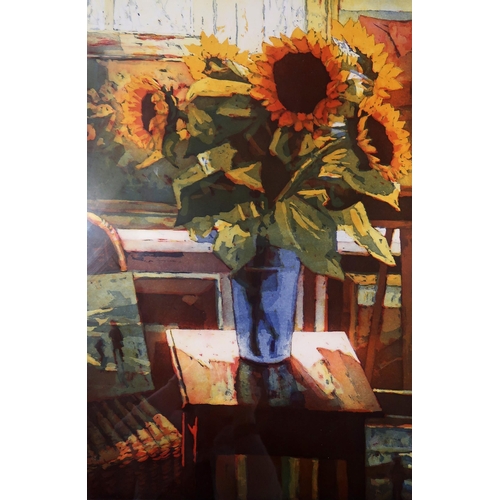 942 - MARCEL SCHELLEKENS (DUTCH CONTEMPORARY b.1954)STILL LIFE OF SUNFLOWERS IN A VASE IN A DOMESTIC ... 