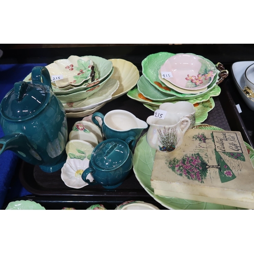 215 - A quantity of Carltonware including green press moulded trinket dishes, plates, cups and saucers, ye... 