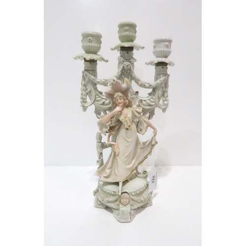 222 - A figural three light candelabrum modelled as a lady, impressed DEP & 9748 to back