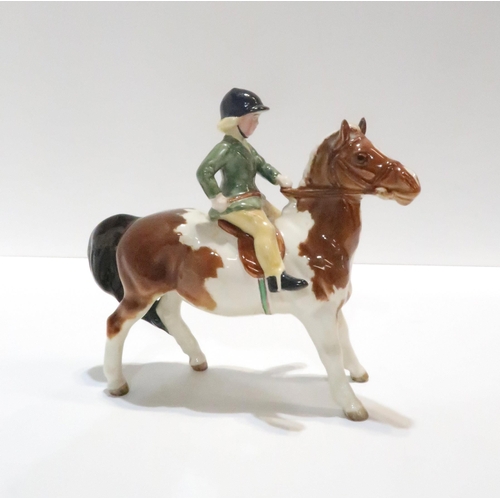 225 - A Beswick Horse and Child Jockey figure