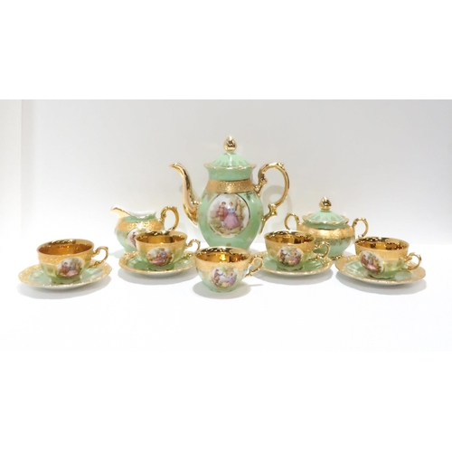 227 - A Royal Bavaria green ground and gilt decorated tea service decorated with cartouches of courting co... 