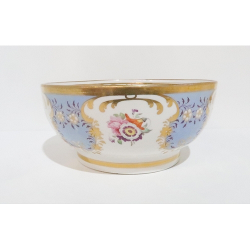 230 - An English porcelain bowl, the pale blue ground gilt decorated and hand painted with  floral sp... 