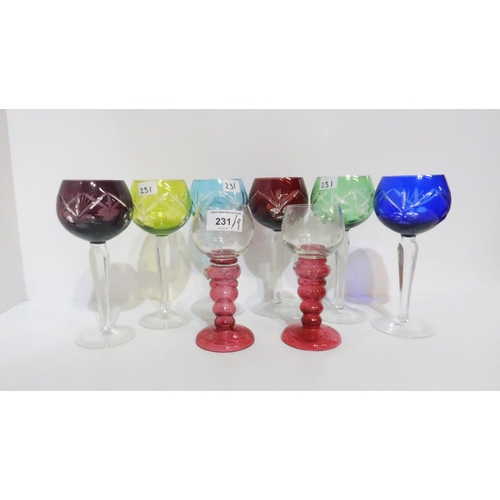 231 - A set of flashed and cut glass wine glasses, a pair of pink stemmed roemers with etched grape and vi... 