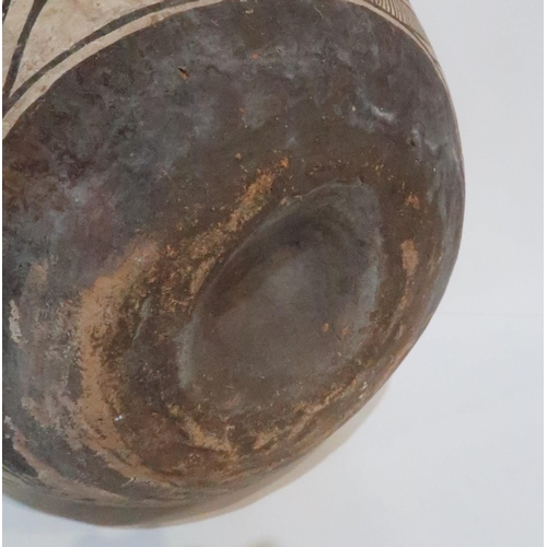 233 - **WITHDRAWN** A Pre-Columbian earthenware bowl, of bulbous form, painted with geometric shapes in bl... 