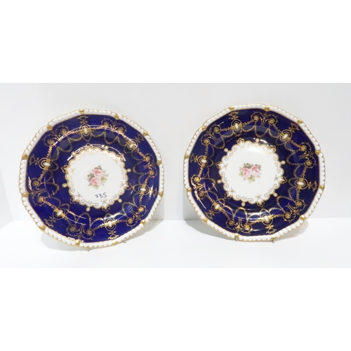 235 - A pair of Royal Crown Derby blue ground and gilt decorated plates with painted floral decoration, da... 