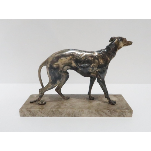 237A - A white metal model of a greyhound modelled in a naturalistic pose on a rectangular hardstone base