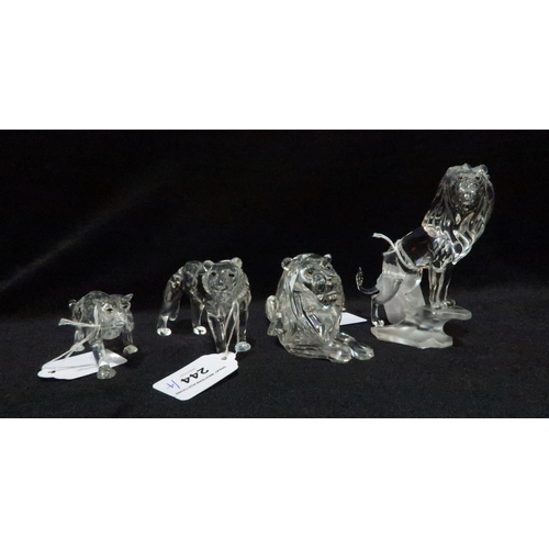 244 - Four Swarovski figures including a standing lion, a seated lion, a lioness and Cheetah, all with box... 