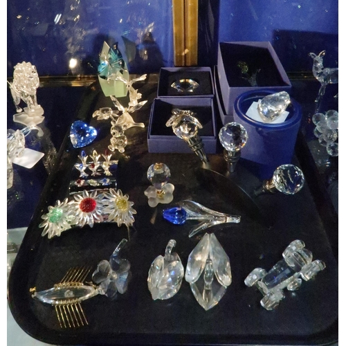 245 - A collection of Swarovski items including butterflies, flowers, starfish, heart, bottle stoppers and... 