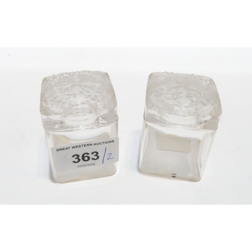 256 - A pair of Lalique for Coty square glass jars with frosted floral lids, 5.5cm high