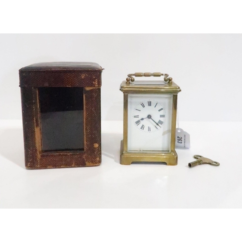 263 - A 19th century French brass carriage clock with white enamel dial and roman numeral chapter ring, wi... 